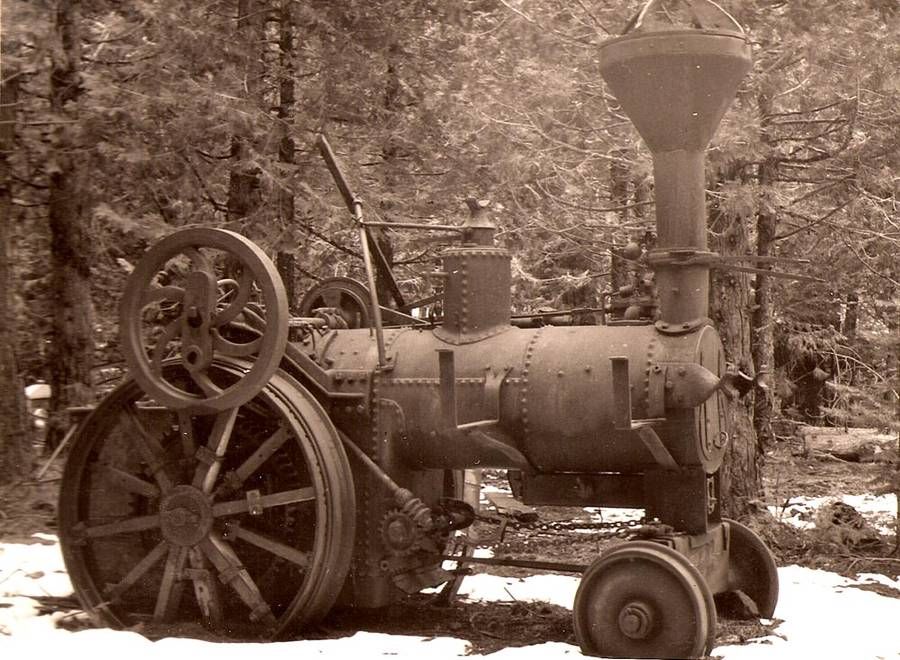 USA The steam traction engine, Jenny, sits in mud and snow deep in the woods long after being abando
